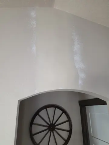 Smooth finish coat over the reinforced archway crack repair