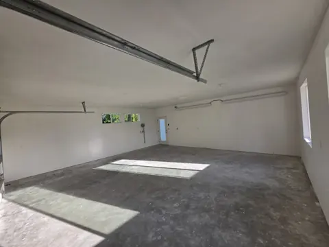 Wide view of the finished and primed garage