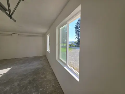 Primed garage walls with a finished window wrap