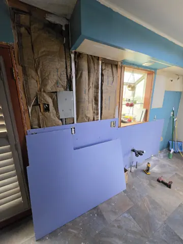 Kitchen wall opened for drywall replacement