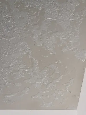 Close view of skip-trowel wall texture